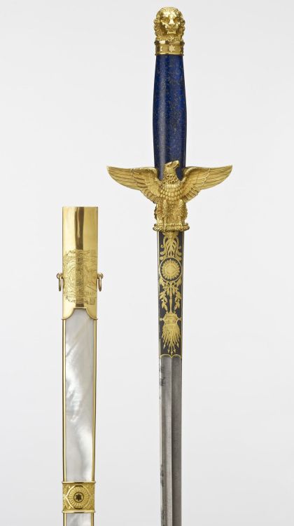 art-of-swords:  Robe Sword (with scabbard and baldric)Dated: 1800-02Maker: Nicolas Noël Boutet (1761-1833)/Manufacture de VersaillesCulture: FrenchMedium: gold, lapis lazuli, mechanically-watered steel. Scabbard: wood, mother-of-pearl framed in gold.