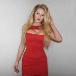 Busty blonde in red