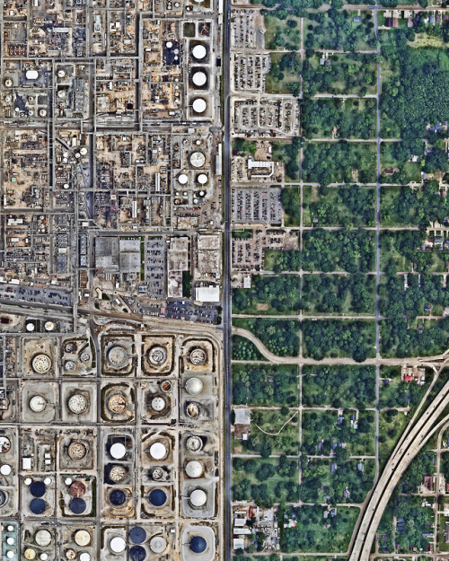 dailyoverview:A residential neighborhood sits adjacent to a large oil refinery in Baton Rouge, Louis