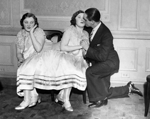 weirdvintage:Margaret Gibbs gets a kiss from her betrothed, while her conjoined sister Mary looks on