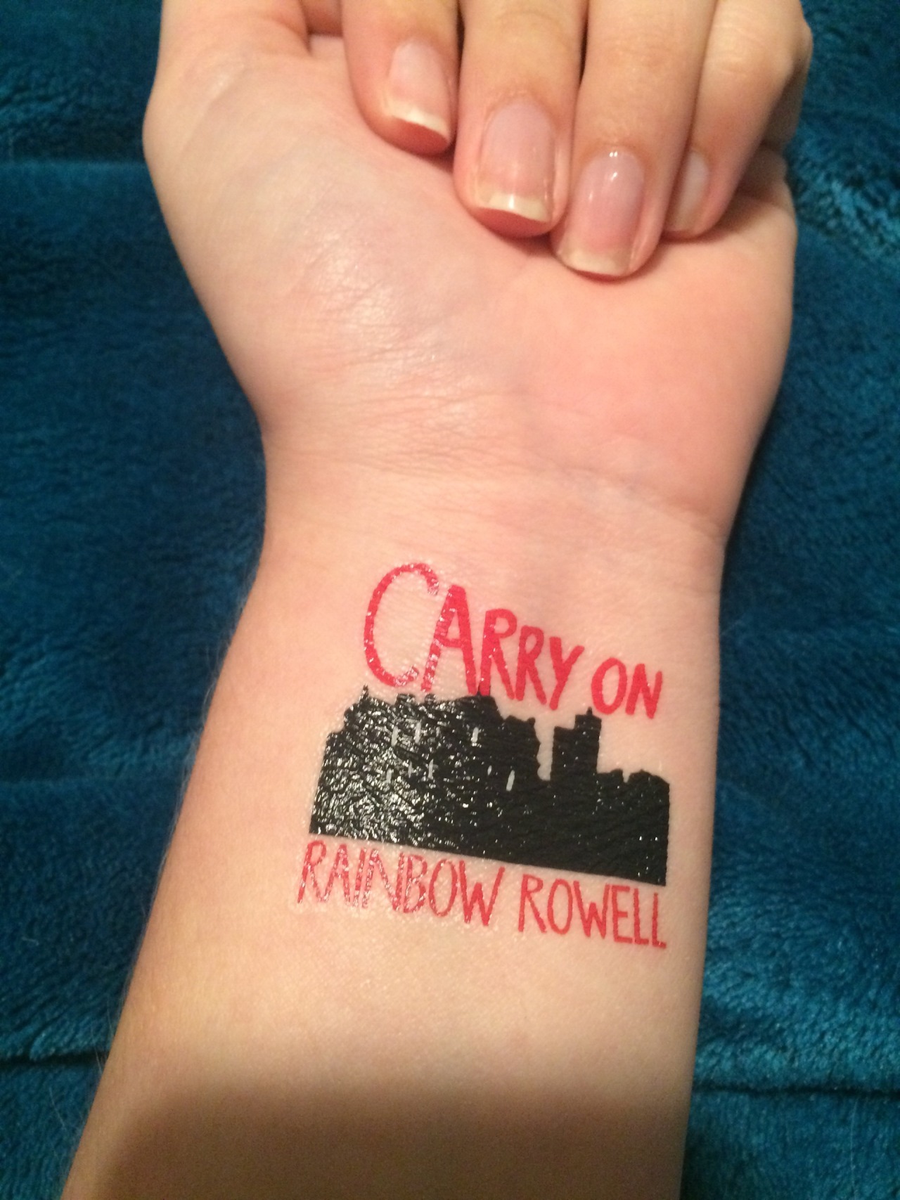 Keep calm and carry on tattoo on the right thigh