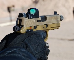 gunrunnerhell:  FN FNX-45 TacticalAs it’s name suggests, the FNX-45 Tactical has several key features that differ from the standard model. The major differences are the threaded barrel, raised front and rear sights and a slide cut for mounting optics.