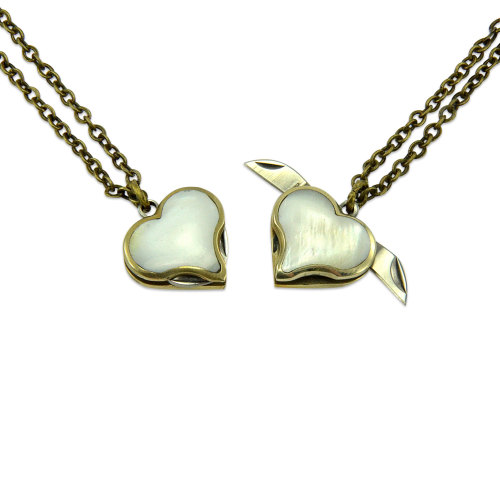 wickedclothes:  Tiny Secret Heart Double Knife This heart necklace is more than meets the eye. Open up the sides to reveal two hidden knives. Hung on a 24” chain. Sold on Etsy.