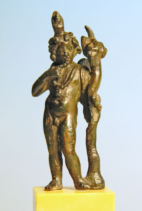 rodonnell-hixenbaugh: Roman Bronze Cupid An ancient Roman bronze statuette of Cupid, the winged youn