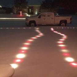 coluring:  the christmas lights are still glowing underneath the snow 