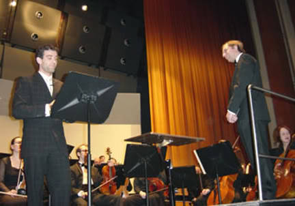 Photo of Stefán Karl in a orchestra at the Háskólabíó hall