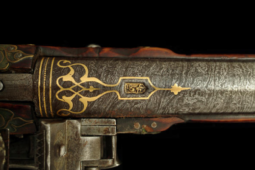 A set of Turkish miquelet pistols, gold inlaid Damascus barrels, engraved silver mounts, and an ivor