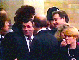 Freddie Mercurys Funeral At West London Crematorium November 27, 1991.Brian May Hugging Peter Phoebe