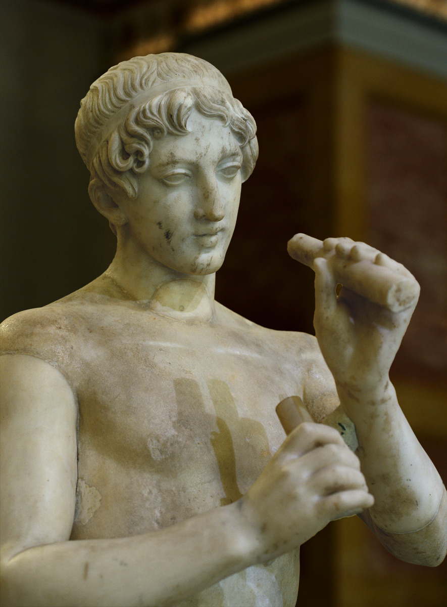 theancientwayoflife: ~Youth playing flute. Medium: Marble Roman copy after a Greek