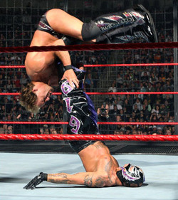 fishbulbsuplex:  Rey Mysterio vs. Chris Jericho  Looks like some very kinky sex positions going on here.