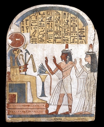 Ancient Egyptian wooden funerary stela of a man named Naftekhmut, showing him and his daughter Shepe