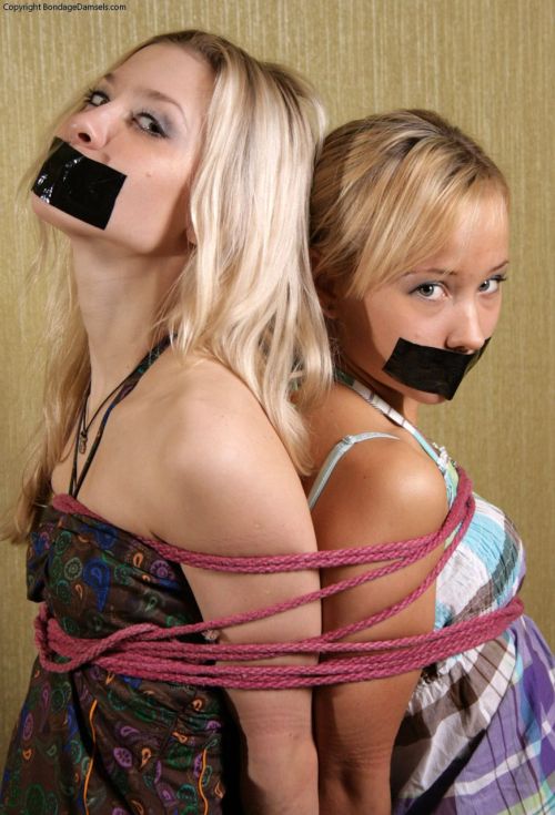 Back to back lovely captives bound and gagged