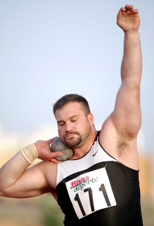 herofiend1983:  How to stay warm on a cold winter’s night….  Hot men like former Olympic Shotputter Manuel Martinez of Spain! Check out my new tumblr page “Facial Hair Fetish”…. Where the men are separated from the boys!  