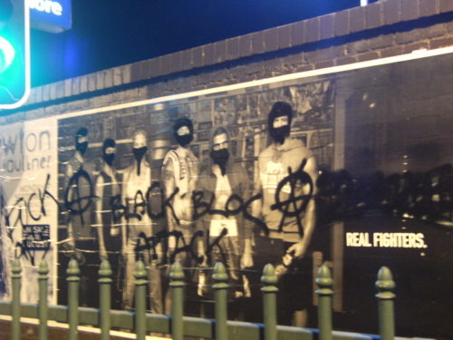 Subverted ad from Stanmore Sydney. Now reads: “Fuck ads (A) Black bloc attack (A)’