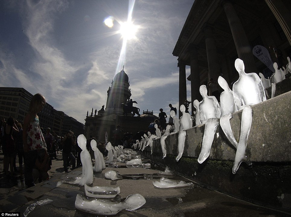 sixpenceee:  A thousand miniature people have slowly melted away in a Berlin square