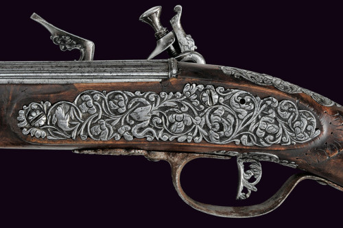 A pair of silver mounted flintlock pistols signed “Lazarino Cominazzo”. Originates from 