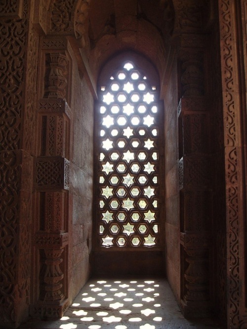 Ancient mosaic window in the Qutub Minar complex in Delhi, India