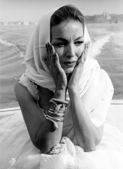 ohyeahpop:  Portrait of Mexican actress Maria Félix wearing a Cartier snake bracelet and a scarf around her head on a boat at the Venice Film Festival. Photo by Emilio Ronchini, Venice, August 1959. 