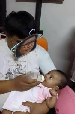 sixpenceee:  His wife passed away and their baby refused to eat. However, when he used a homemade mask with a photo of the mothers face on it during feeding, the baby stopped crying, smiled &amp; drank her entire bottle. 