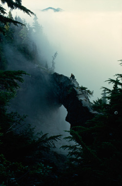 wassupmyhippy:  mpdrolet:  Hikers stand near the top of a natural rock bridge on Mt. Rainier, Washington, May, 1963 Barry Bishop  Travelling - queued! :) 