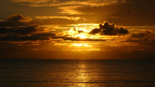 Sunrise over Lake MalawiLake Malawi sits near the southern end of the East African Rift Zone and bor