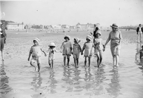Deauville, la plage (Baignade familiale) = The Beach at Deauville (A Family Swim) Photograph by Agen