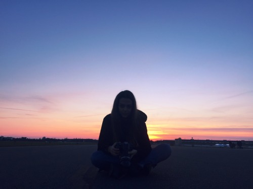 myartfulmoment: I took a photo of her while she was shooting me. The sky was burning and everything 