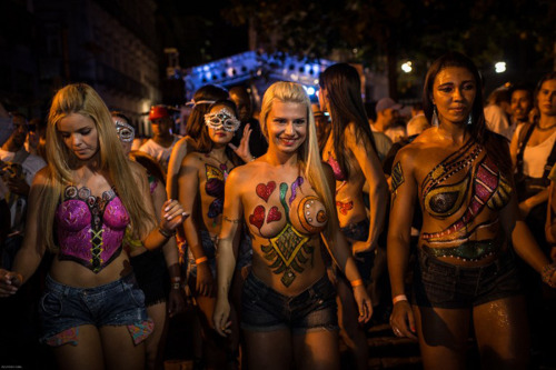 Porn Pics Topless and body painted at a Brazilian carnival,