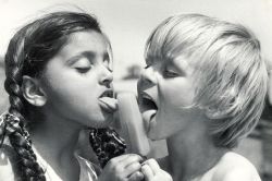 vvlow:  Five-year-old Ravinder Basra of Bolton Road Infants’ School, Handsworth, shares her ice lolly with classmate Ian Tranter in 1976 