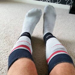 Men in rugby and footy socks