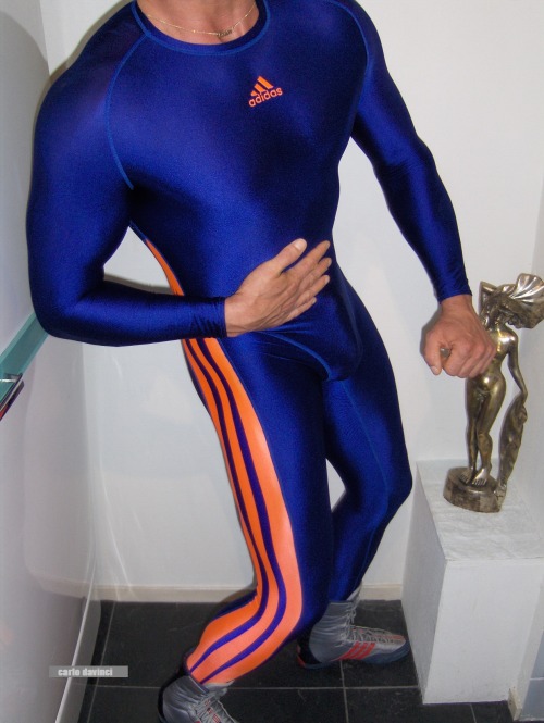 A guy modelling his Adidas Equipment suit.