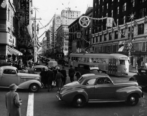 1940: View of the intersection of Grand Avenue (foreground) and Seventh Street, which has been decor