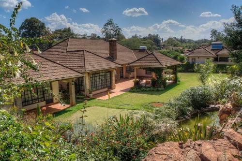 Picturesque cobblestone street in the affluent suburb of Karen just south of Nairobi, Kenya.