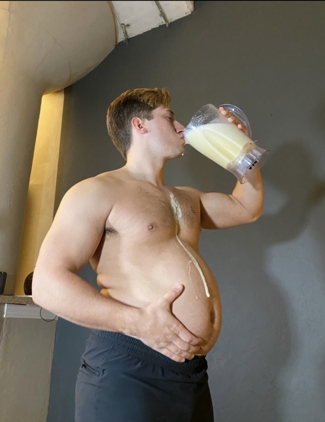 thic-as-thieves:Almost 3000 calorie shake! This is what I make him drink when he doesn’t hit his weekly weigh-in! Look at that shake roll down his growing belly 🤤 don’t worry, I made sure to lick it up 😛😈 video plus more pics on our patreon!