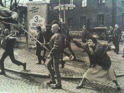 skinsandpins:  A woman hitting a skinhead with her handbag, Sweden, 1985. The woman was reportedly a concentration camp survivor. 