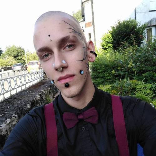 punkerskinhead: handsome shaved, tattooed and pierced guy