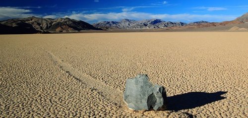 sixpenceee:  sixpenceee:  MYSTERY OF THE MOVING STONES Heavy stones (700 pounds) seemed to have moved by themselves in Death Valley National Park. They left behind a trail in the cracked mud. Some trails measured as far as 820 feet.  How did these huge
