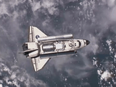 humanoidhistory:  The Space Shuttle Discovery performs a “rendezvous pitch maneuver”