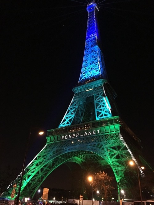 destielette:The Eiffel Tower is illuminated in green and blue tonight. See, even The Eiffel Tower sh