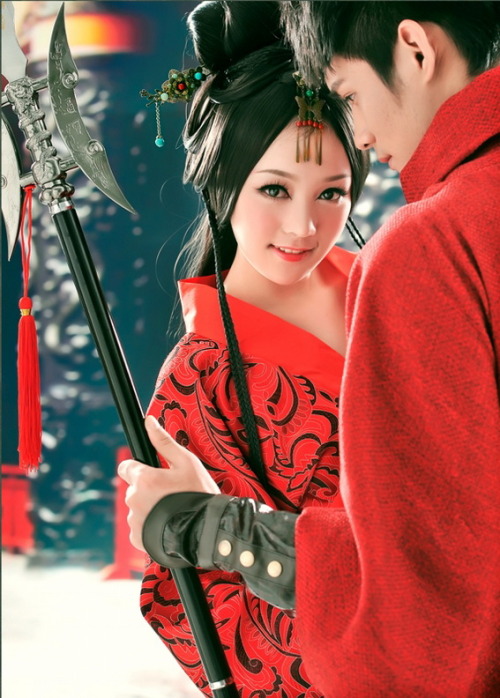 Lovely asian couple wearing red kimonos