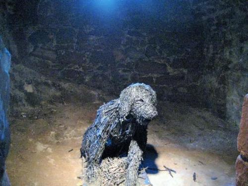 cryptid-wendigo:  “Let him come!  I’ll see whether he be dog or devil!” This sculpture of the Moddey Dhoo (Mauthe Doog)resides where the supposed Hellhound itself does - Peel Castle on the Isle of Man. The Moddey Dhoo is said to resemble a black,