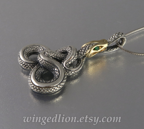 Our newly designed Ouroboros pendant in silver and 14k gold with emeralds