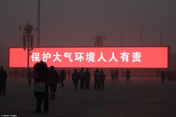 zhong-guo:  qarcon: The LED screen shows the slogan ‘protecting atmospheric environment is everyone’s responsibility’ on the Tiananmen Square which is shrouded with heavy smog on January 16, 2014 in Beijing, China  ☯ All things China ☯