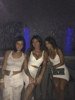 Two tight dresses and a white tank top.