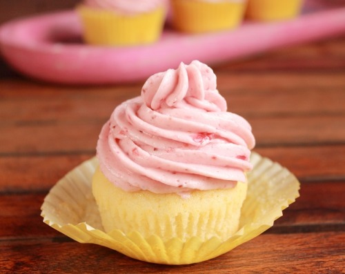 bakeddd:  lemon cupcakes with strawberry swiss meringue buttercream  click here for recipe 