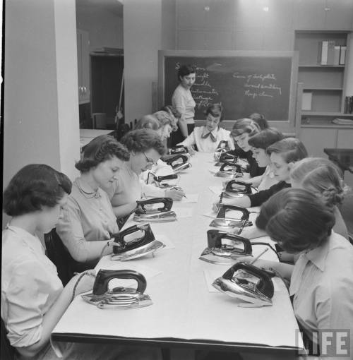 Cornell students appear to be studying the electric iron(Nina Leen. 1951)