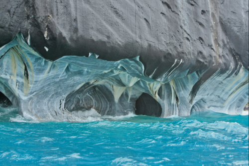 sixpenceee:It took 6,000 years of churning of water to carve Argentina’s Marble Caves.