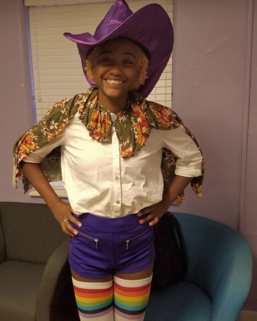 pldubrahs:[ID: two pictures of me, a nonbinary black person with a short blond afro, in taako cospla