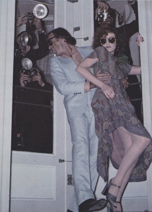 On her - Dress: Franck OliverOn him - Suit: Bill BlassShirt: Turnbull &amp; AsserOui Magazine, April