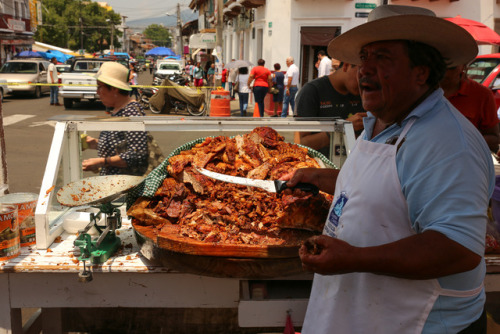 roundmexico:Carnitas at the Quiroga, Mexico, Sunday market.